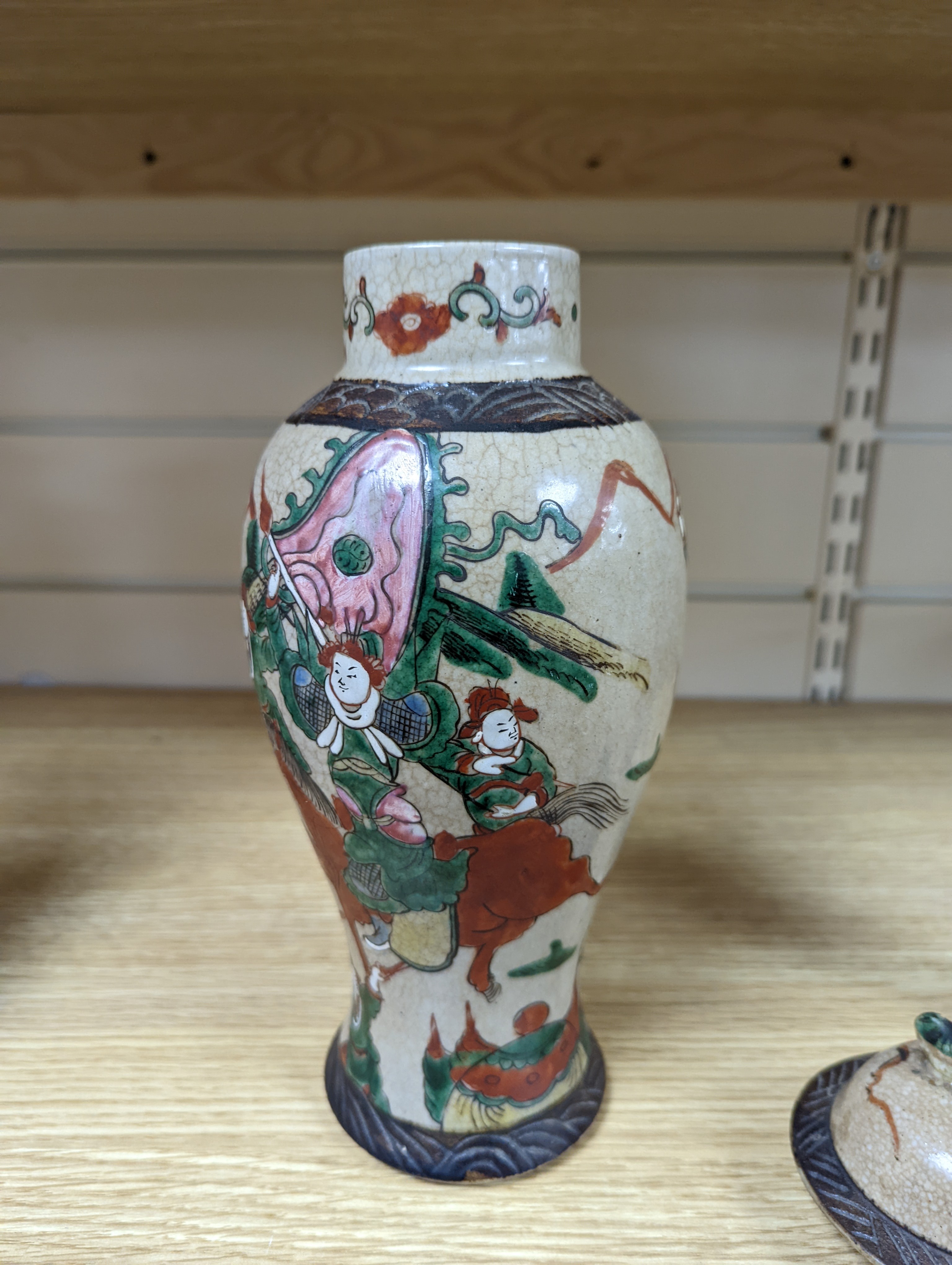 A late 19th century Chinese crackle glaze famille rose baluster vase and cover 30cm